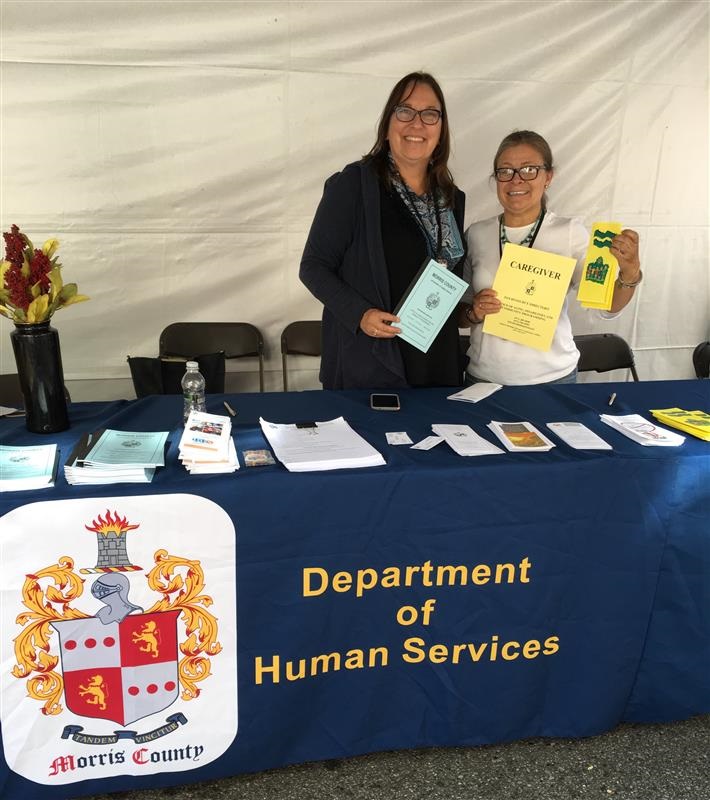 Lucy D'Anna volunteering at a community festival (left) pictured with Social Services Supervisor Marisol Heredia (right) Lucy D'Anna at community festival 2020.jpg