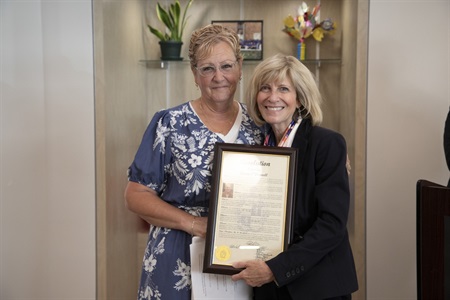 Susan O’Donnell and Morris County Commissioner Christine Myers with a resolution she presented on behalf of the entire Morris County Board of County Commissioners.