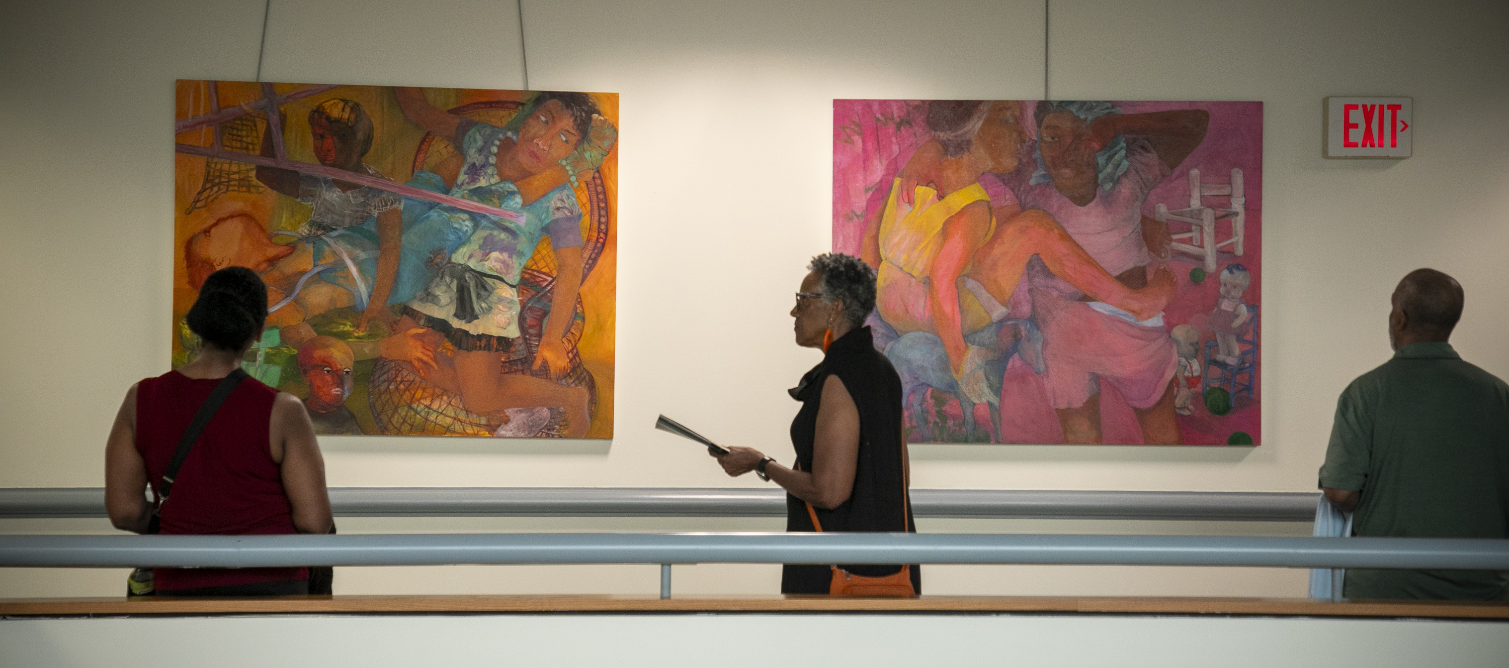 Reception attendees admire work by Philemona Williamson, one of the featured artists.