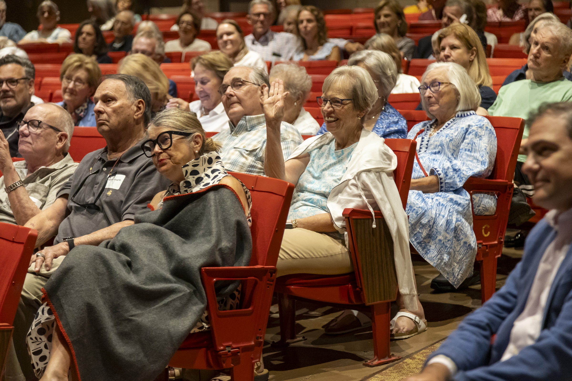 Members of the audience enjoy the question-and-answer session with Ken Magos.