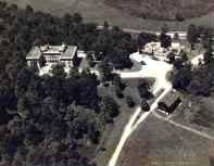 An aerial view of the Farm, taken about 1950, showing the woods surrounding the building