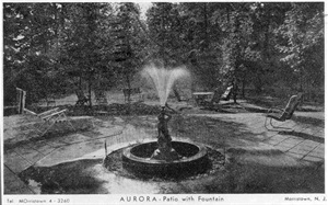 The center fountain, water shooting up the center channel, surrounded by lounging chairs