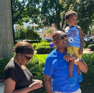 (L-R) Brenda Curry, Clarence Curry, Jr., and grandson, Maximus.