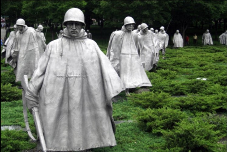 Statues of soldiers in helmets and large rain jackets at the Korean War Memorial in Washington DC