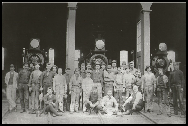 Volpe at the Port Morris Roundhouse, with a group of railroad workers