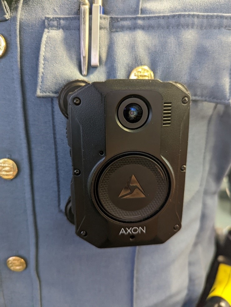 Camera, word by a Sheriff's officer on their front pocket