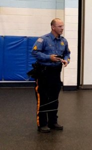 Morris County Sheriff's Office Detective Sergeant Jamie Rae volunteered to be 'restrained' around the legs by the BolaWrap device designed for law enforcement officers. 