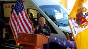 Morris County Sheriff's Office Corporal Erica Valvano, "the mother of Hope One," speaks at a ceremony on August 3 about the impact of the outreach program and gratitude for a new vehicle.