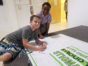 Two Unity boys sign the Stigma-Free banner