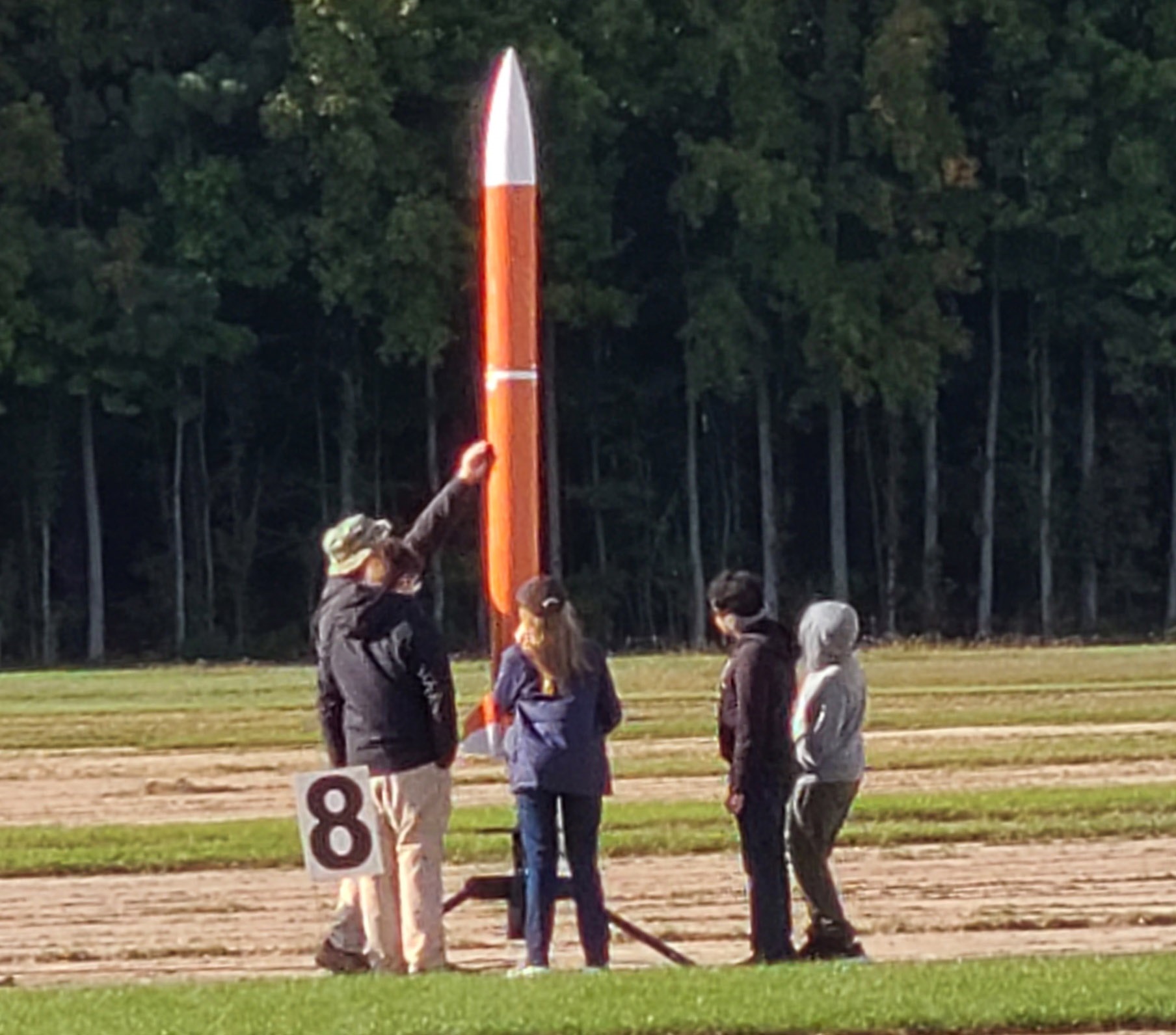 4-H rocket team with rocket on launchpad