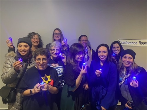 Members of Campaign holding blue lights