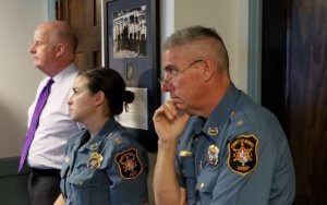 From left, Morris County Sheriff James M. Gannon, Chief Sheriff's Officer Kelley Zienowicz and Chief Warrant Officer Richard Rose listen to briefing by Agency Accreditation Manager Detective Captain Denise Thornton.