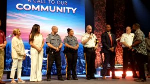 Morris County Sheriff James M. Gannon, standing beside uniformed Sheriff's Officers Travis Somerville and Kayla Santos, introduces himself as a guest of Christ Church's Prayerfest 2019 on July 26. 