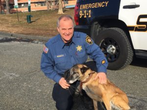 Morris County Sheriff's Office Detective John Granato with K-9 Cinders, a Belgian Malinois.