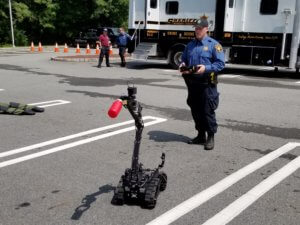Morris County Sheriff's Office K-9 Section and Bomb Squad Detective Dave Marshall demonstrates the maneuverability of a miniature robot used as a tool in explosives investigations. 
