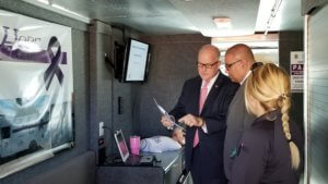 Morris County Sheriff James M. Gannon with Sheriff's Office Corporal Erica Valvano and Dennis Gonzalez, United States Department of Health and Human Services Regional Executive Officer on Hope One. 