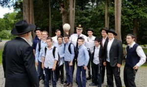 Morris County Sheriff James M. Gannon was at the Rabbinical College of America in Morris Township on June 14 for business, but students tried to corral him into a ball game. At left is Rabbinical College of America Dean, Rabbi Moshe Herson. 