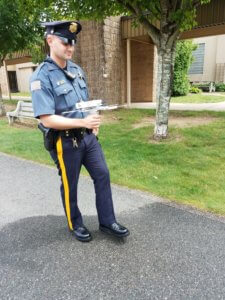 Morris County Sheriff's Officer Travis Somerville holds a tracker used to find participants of Project Lifesaver.