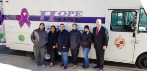 A Hope One team with Mark and Maria Broadhurst in Dover in February 2020. From left, Mental Health Advocate Al Shurdom, Maria Broadhurst, Mark Broadhurst, Certified Peer Recovery Specialist Caroline Bailey, Morris County Sheriff's Office Corporal Erica Valvano and Morris County Sheriff James M. Gannon. 