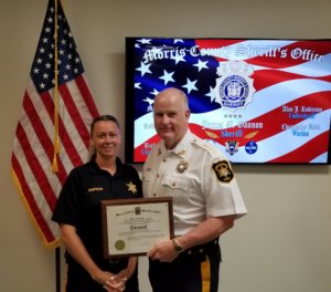 Morris County Sheriff James M. Gannon with Correctional Facility Corporal Dawn Simpson.