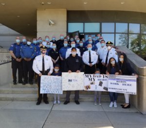 In front row, from left, Morris County Sheriff James M. Gannon, Kailiee Otaegui, Corrections Officer Anthony Otaegui, Khloe Otaegui, Krystal Otaegui, and Stephanie Otaegui, the Officer's wife.