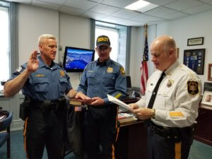 Retired East Hanover Police Department Captain Jack Ambrose takes the oath of office as a Class Two Special Law Enforcement Officer for the Morris County Sheriff's Office. Sheriff James M. Gannon is reading the oath while Bureau of Law Enforcement Undersheriff Mark Spitzer holds the Bible. 