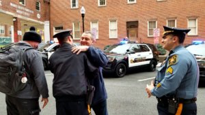 Retired Morris County Sheriff's Office Detective Captain Mark Chiarolanza hugs Lt. Michael Turkot at his retirement walkout on January 31, 2020. 