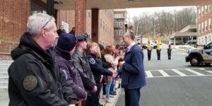 Morris County Sheriff's Office Detective Captain Mark Chiarolanza says goodbye to colleague friends during a walkout for his retirement on January 31, 2020. 