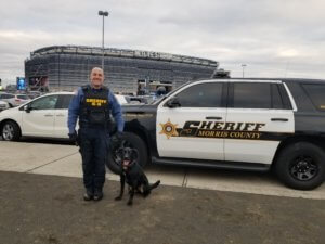 Morris County Sheriff's Office K-9 Section Detective Michael Carbone with K-9 Kaboom at MetLife Stadium. 
