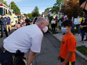 Morris County Sheriff James M. Gannon congratulates Nesim Aktas, 9, of Boonton, for courageously battling leukemia.