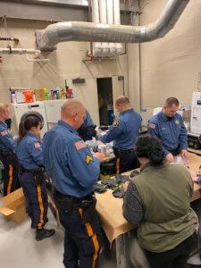 Morris County Sheriff's Officers prepare personal protection gear for fellow Officers to use during the outbreak of COVID 19. 