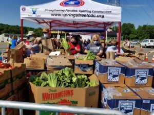 Volunteers sort groceries during the June 23 Table of Hope Mobile Food Pantry food distribution at County College of Morris.