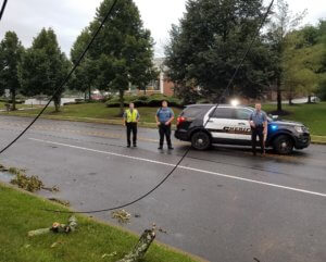 Morris County Sheriff's Officers Ivan Bajceski and Frank Pirog and Corporal Ryan Warnett secured portions of Center Grove Road in Randolph after Tropical Storm Isaias downed power lines. 