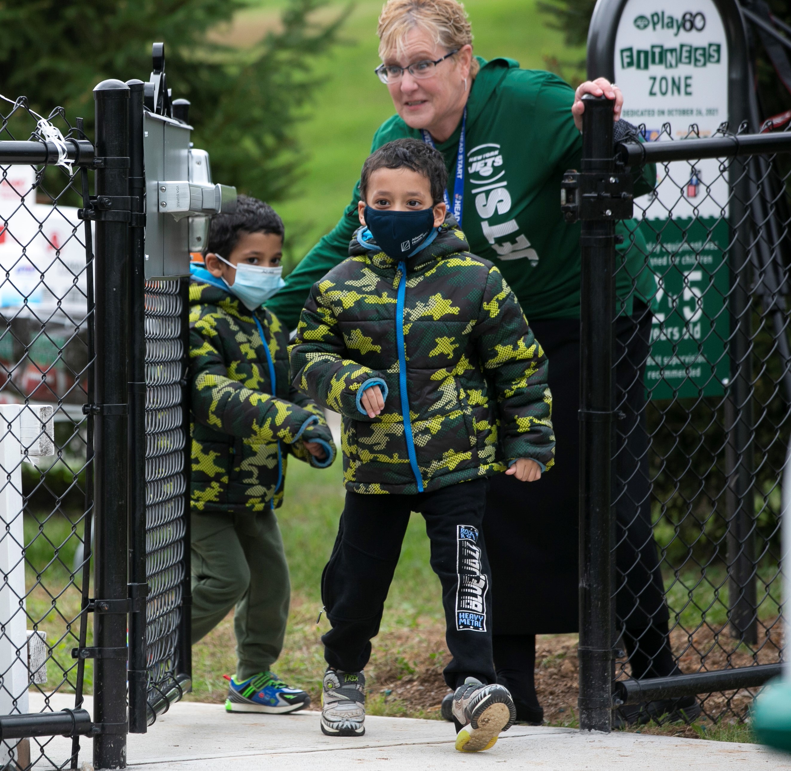 Head Start's Susan O'Donnell opens the playground gate.jpg