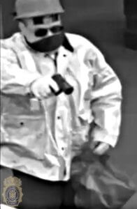 photo of bank robber pointing a gun