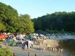 Tents lined up on the beach at Sunride Lake