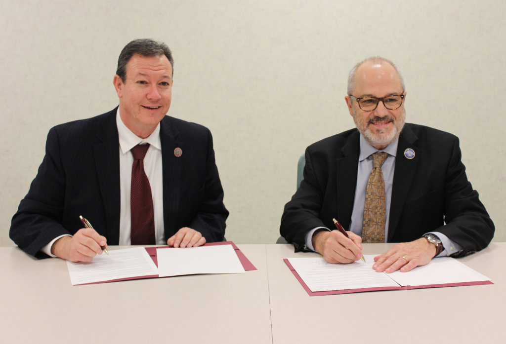 photo of CCM President Anthony J. Iacono and Centenary President David P. Haney signing the agreement