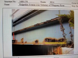 both photos show severe rust in existing bridge superstructure