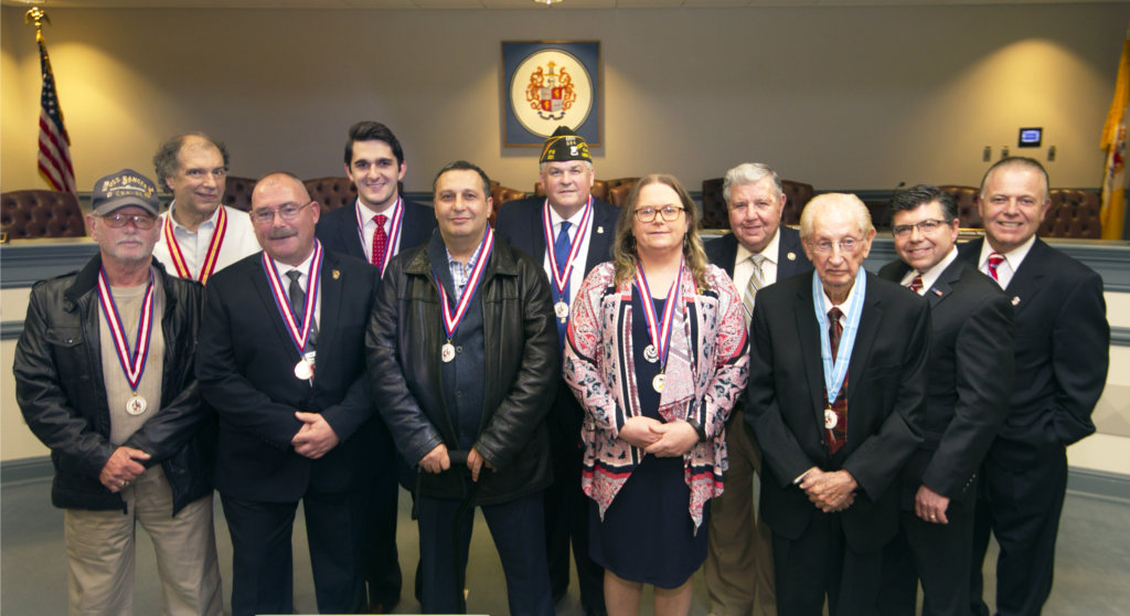 photo of (l/r) front row€”Veterans James Festa, Kenneth Brenzel, Yucel Yilmaz, Loretta Falconer, and Joseph Bonanno; Back row (L/r) Veterans Joseph Takacs, Andrew Lachawiec, Pastor David Boone, and state Sen. Anthony Bucco, state Assemblyman Anthony Bucco, and state Sen. Joe Pennacchio