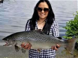 Photo: Runelvy Rodriguez of Northvale shows off her state record 25 3/4-inch landlocked salmon, caught June 2, 2018 in Lake Aeroflex;