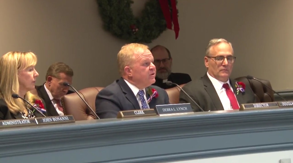Photo of Freeholder Director Doug Cabana addresses the audience at the Jan. 5 annual meeting. Clerk of the Board Debbie Lynch is seated to his left and County Counsel John Napolitano is seated to his right.