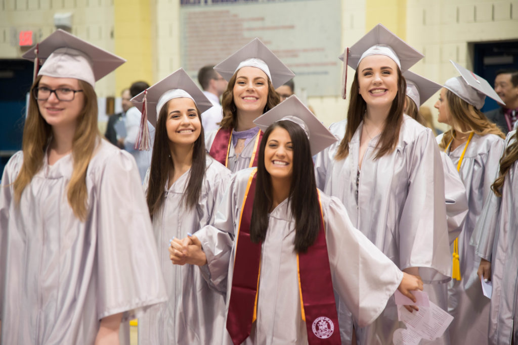  Members of the Class of 2018 at County College of Morris are full of smiles a they enter the commencement ceremony