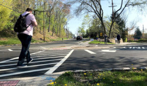 Person crossing street at crosswalk