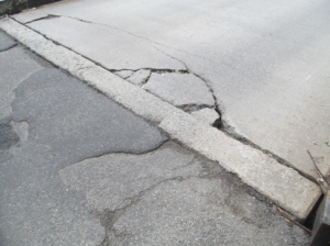 photo shows cracks in the road surface