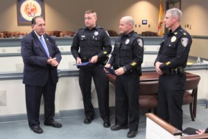 photo of Prosecutor Knapp (L) with Officer Sandman, Officer Grawehr and Captain Partin (R)