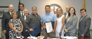 (l/r) Sheriff Jim Gannon, Freeholders Kathy DeFillippo, Stephen Shaw and Doug Cabana; Chief Ed Crooker and Detective Capt. Bruce Dunn; Freeholders Deborah Smith, John Krickus, and Heather Darling; and Assemblyman Anthony M. Bucco