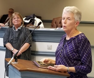 Phyllis Chanda addresses audience as Freeholder Kathy DeFilippo looks on