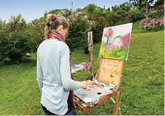 Artist paints in nature
