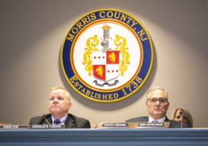 Freeholder Director Doug Cabana and County Counsel John Napolitano watch the presentation on the courthouse needs