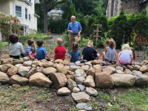 photos of students sitting at rain garden and getting nature lesson